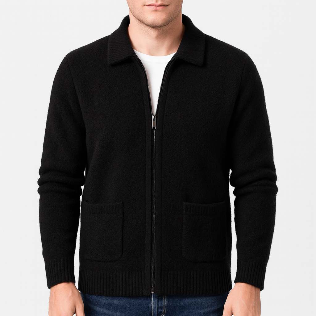 Black zip-up sweater worn by a person on a light gray background